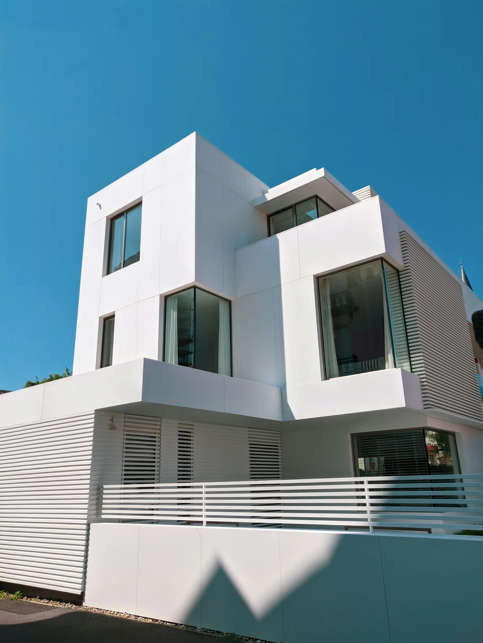 Contemporary home with smooth white acrylic render