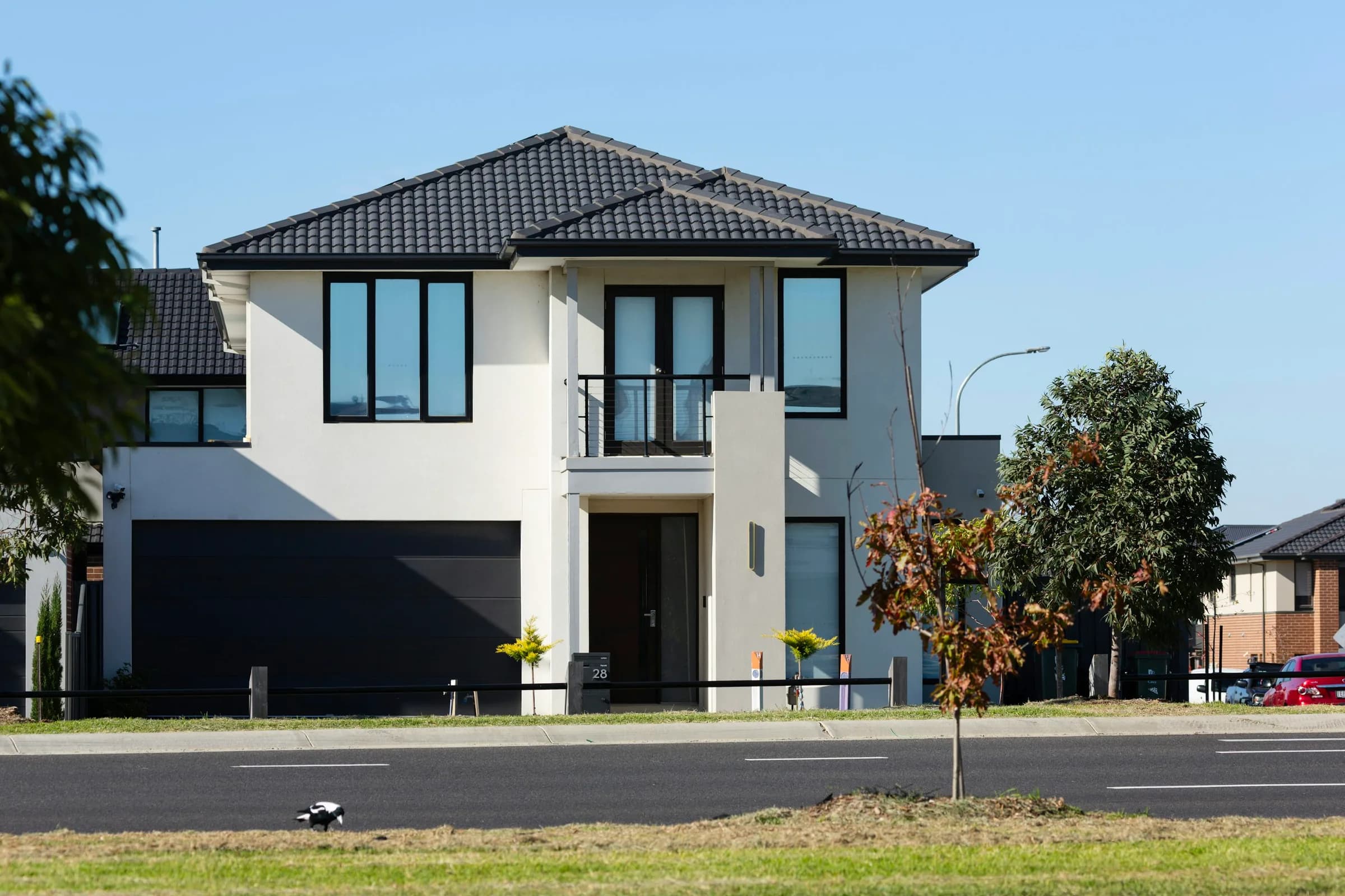 Two-storey Australian home with a smooth rendered-look facade